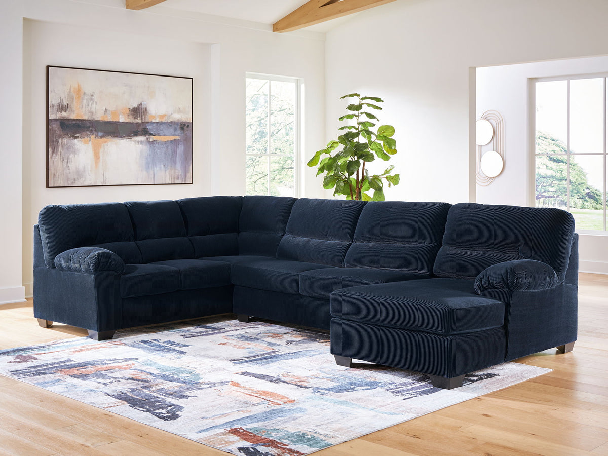 Navy sectional sofa with chaise in a bright living room