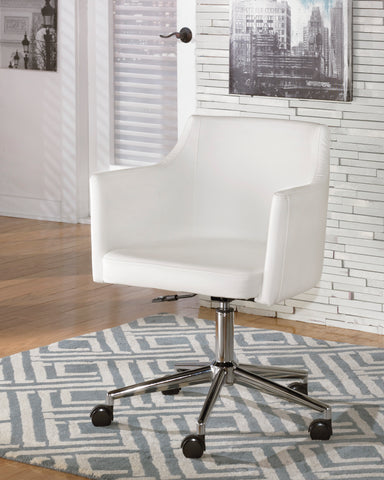 white faux leather swivel office chair. Barrel shaped seating.